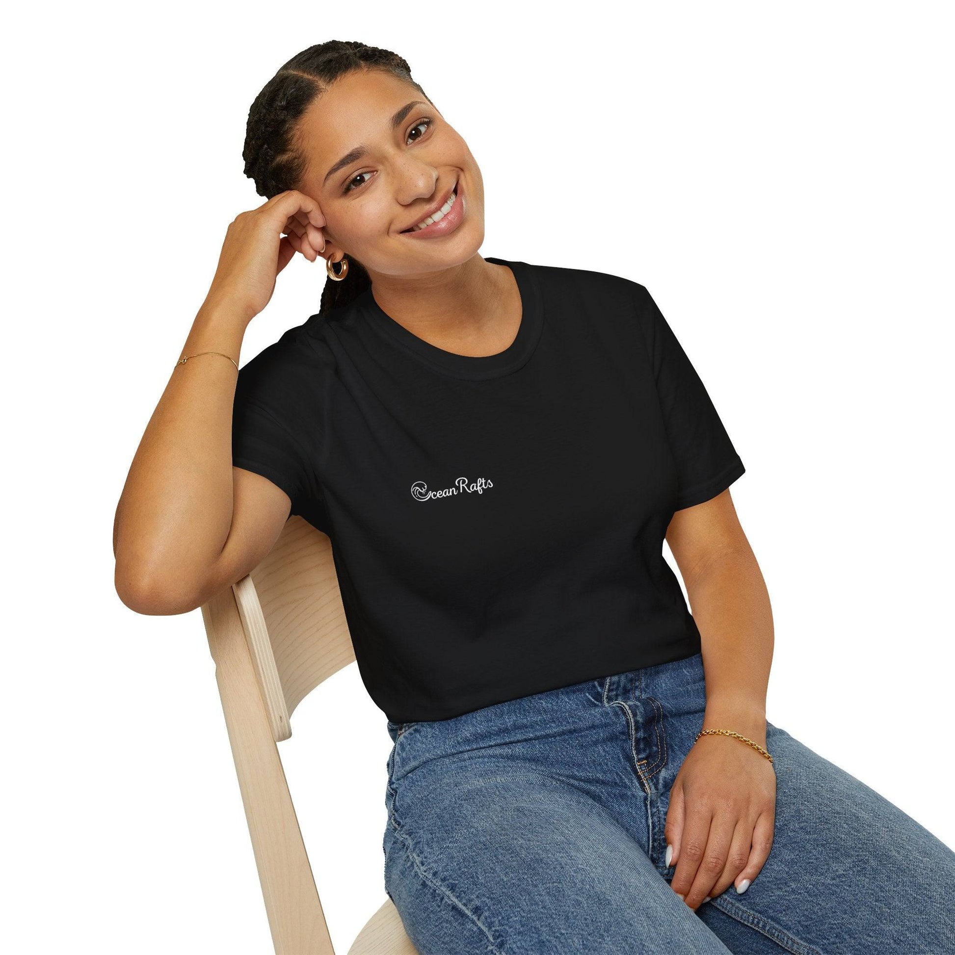 a woman sitting in a chair with a smile on her face wearing a black t shirt with ocean rafts logo  free delivery cheap $35 New Regular fit Leight Weight Elastic Cotton and polyester | Ocean Rafts