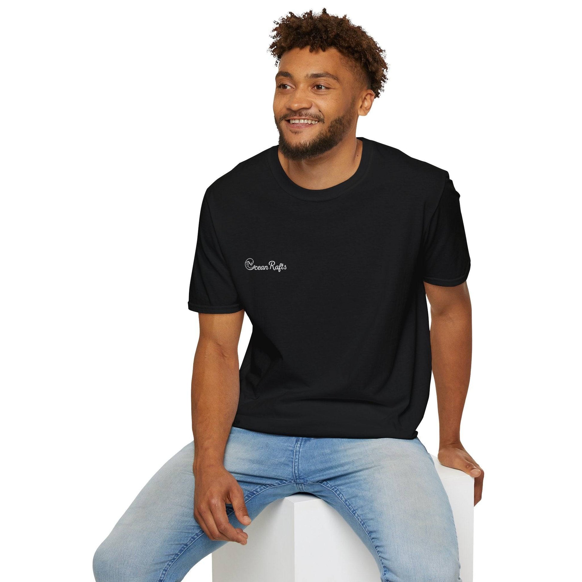 a man sitting on top of a white block wearing a black t - shirt with ocean rafts logo  free delivery cheap $35 New Regular fit Leight Weight Elastic Cotton and polyester | Ocean Rafts