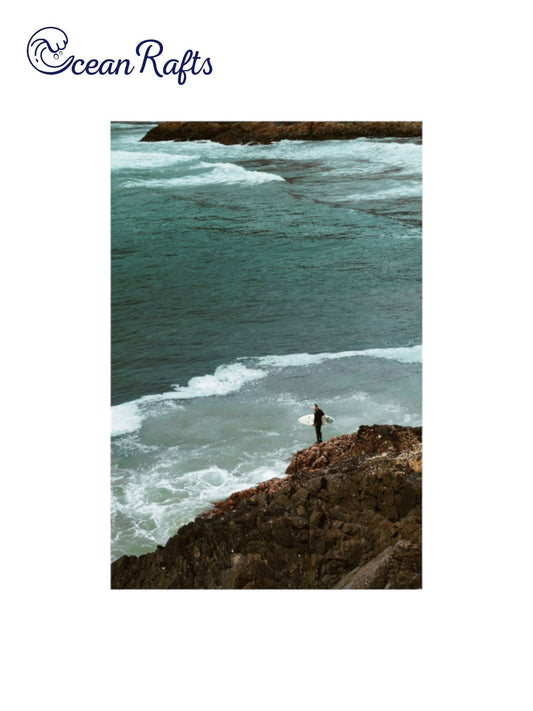 Rockbound Surfer Poster - Image of a alone surfer overlooking the sea ocean with wave coming towards him on the rocks. New and cheap poster with free delivery from only $30 home decor beach styled theme | Ocean Rafts