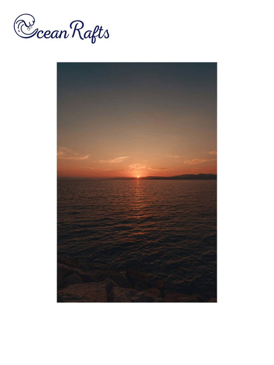 Sunset Serenity Poster - Poster image of a sunset over a varse ocean with the sun half gone luminating orange light into the sky - poster frame home decor new free delivery $30 | Ocean Rafts