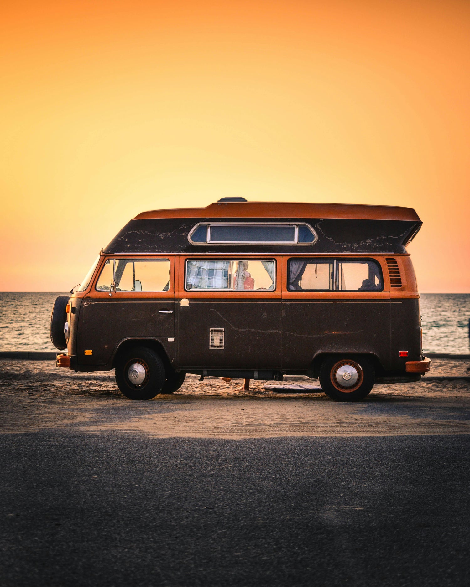 combi van on beach with orange sunset www.oceanrafts.com oceanrafts home page free delivery