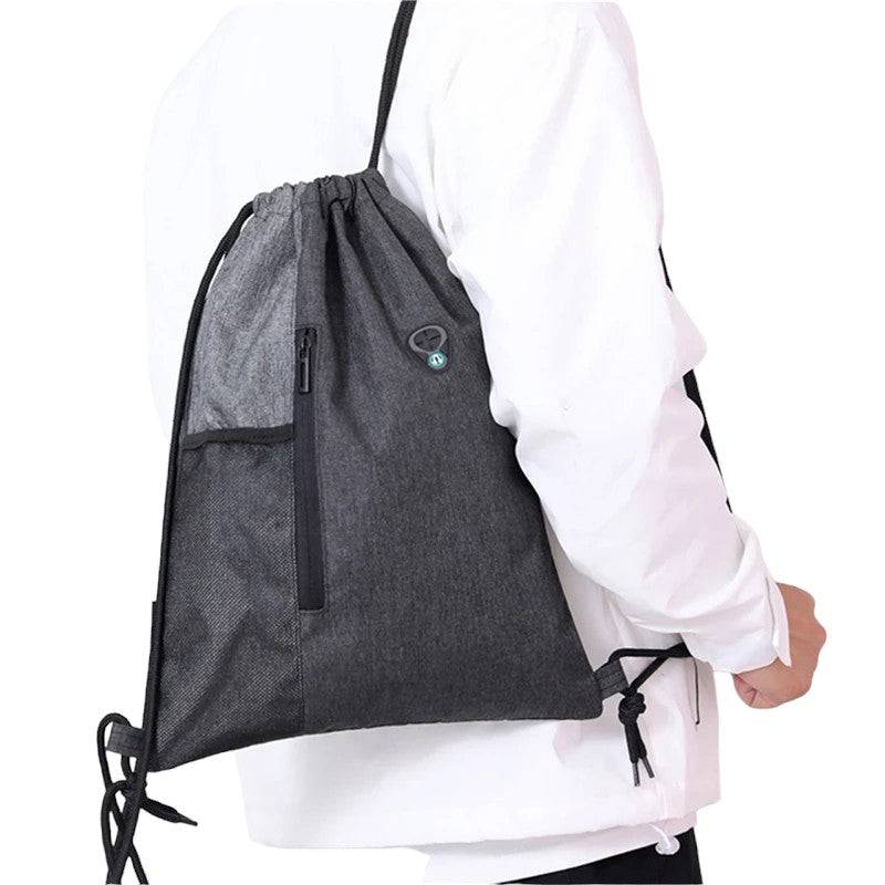 man wearing nylon dawstring bag with water bottle net pocket and 2 zips with extra pouch and pocket free delivery $20 | Ocean Raft